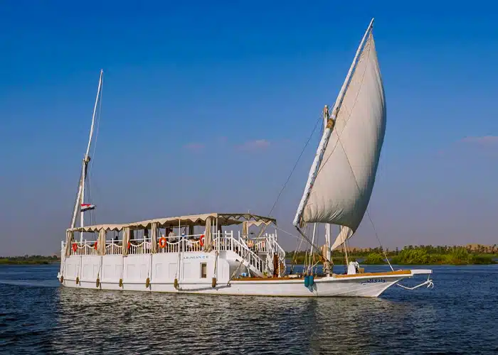 Abundance Dahabiya luxury boat deck with comfortable shaded seating areas and traditional sailing equipment